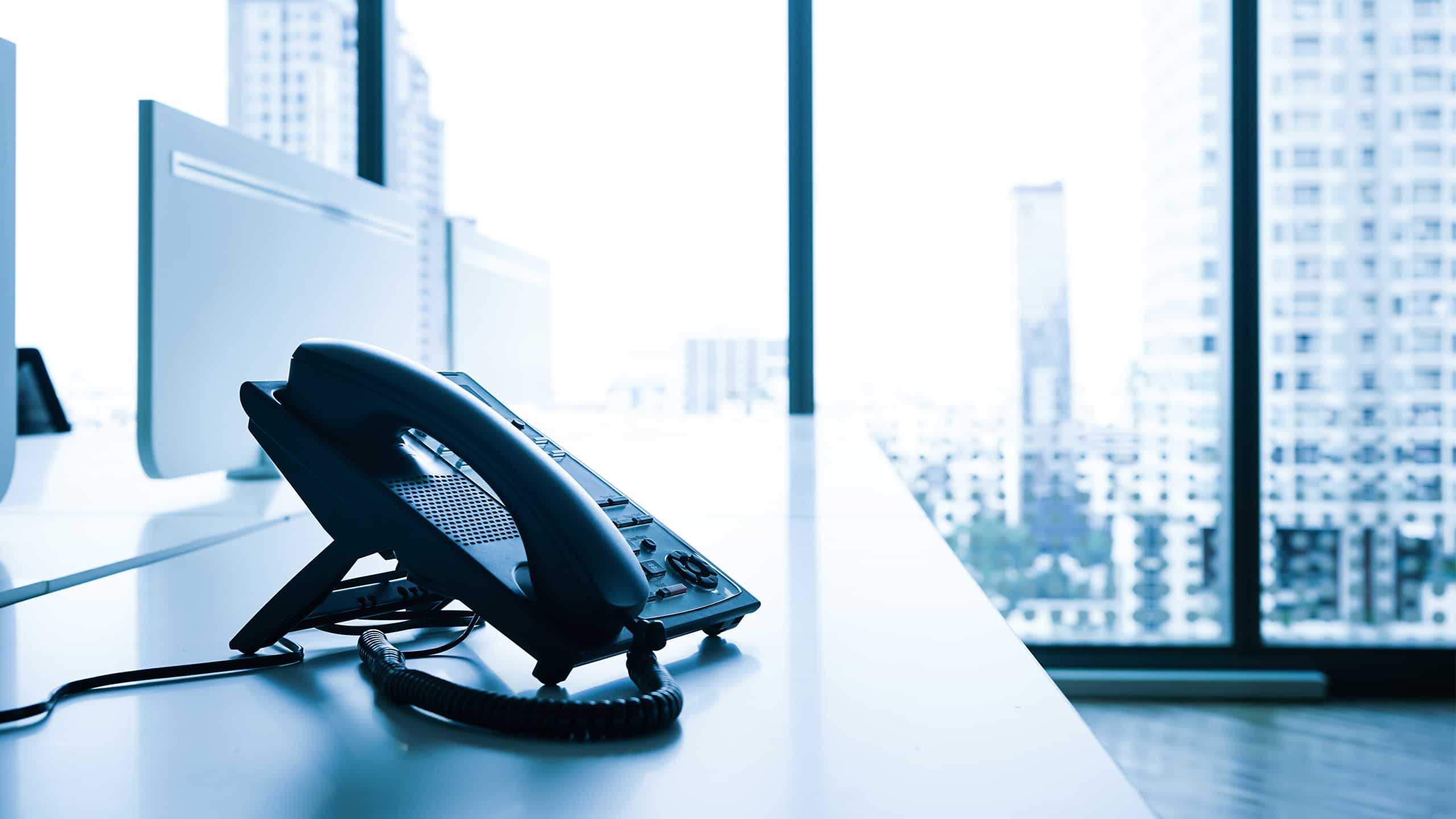 an office phone on a desk